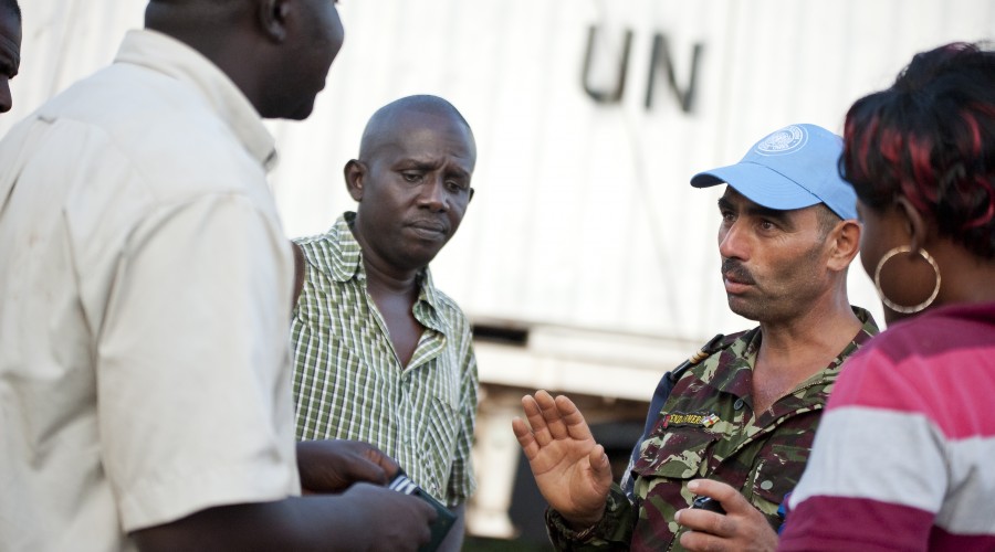 A MINUSCA peacekeeper briefs truck drivers en route to Bambari, CAR