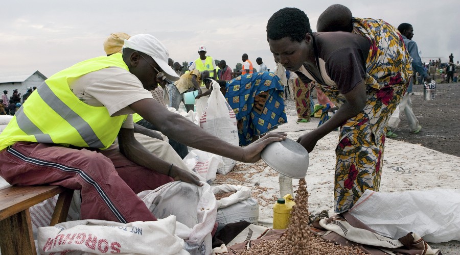 WFP Officer Distributes Food Ration