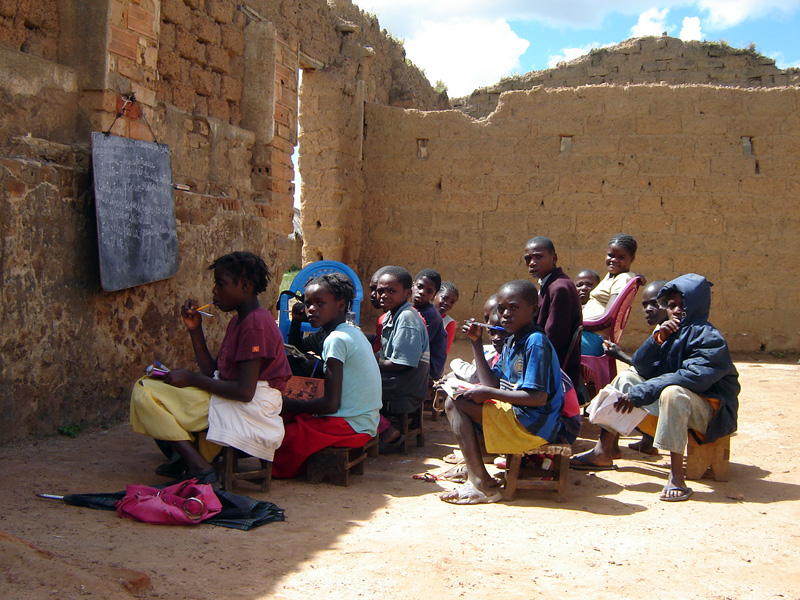 Children in an outdoor classroom in Bié, Angola