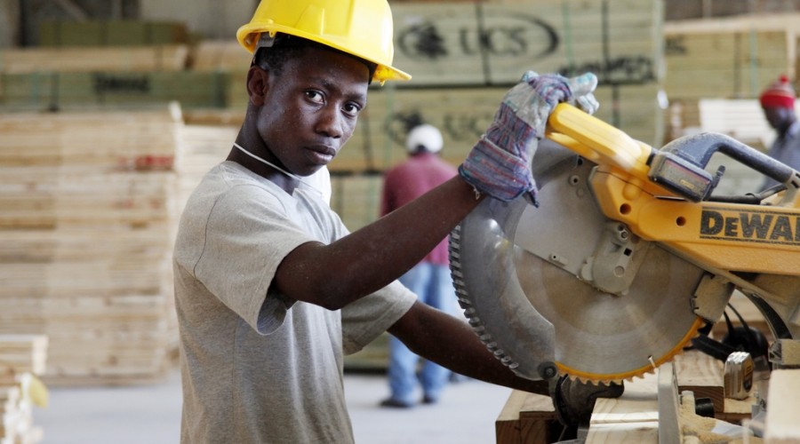 Factory working producing shelter in Port-au-Prince