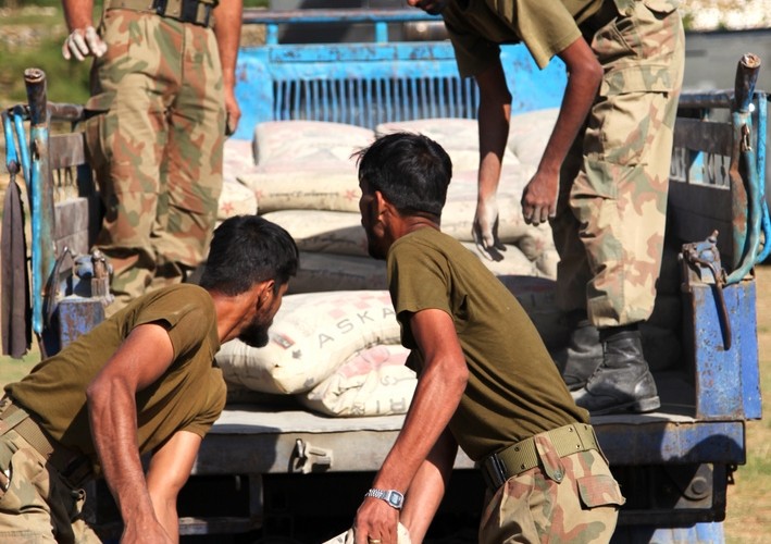 Pakistani soldiers load reconstruction materials onto a truck in Khyber, September 2010