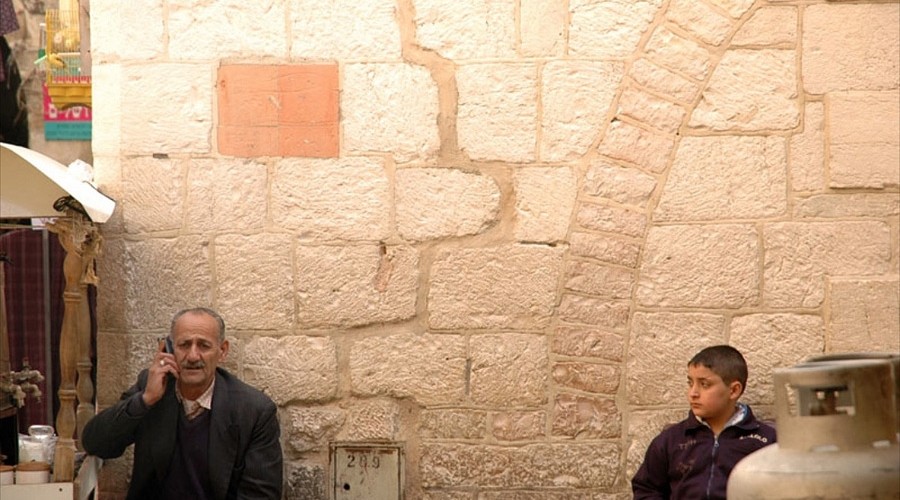 A Palestinian man on his mobile phone in Jerusalems Old City
