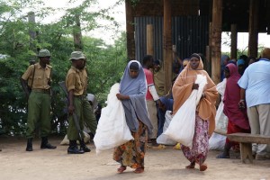 Police guard a food distribution in Ifo Camp
