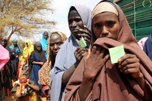 Women queue to receive assistance in Kenya