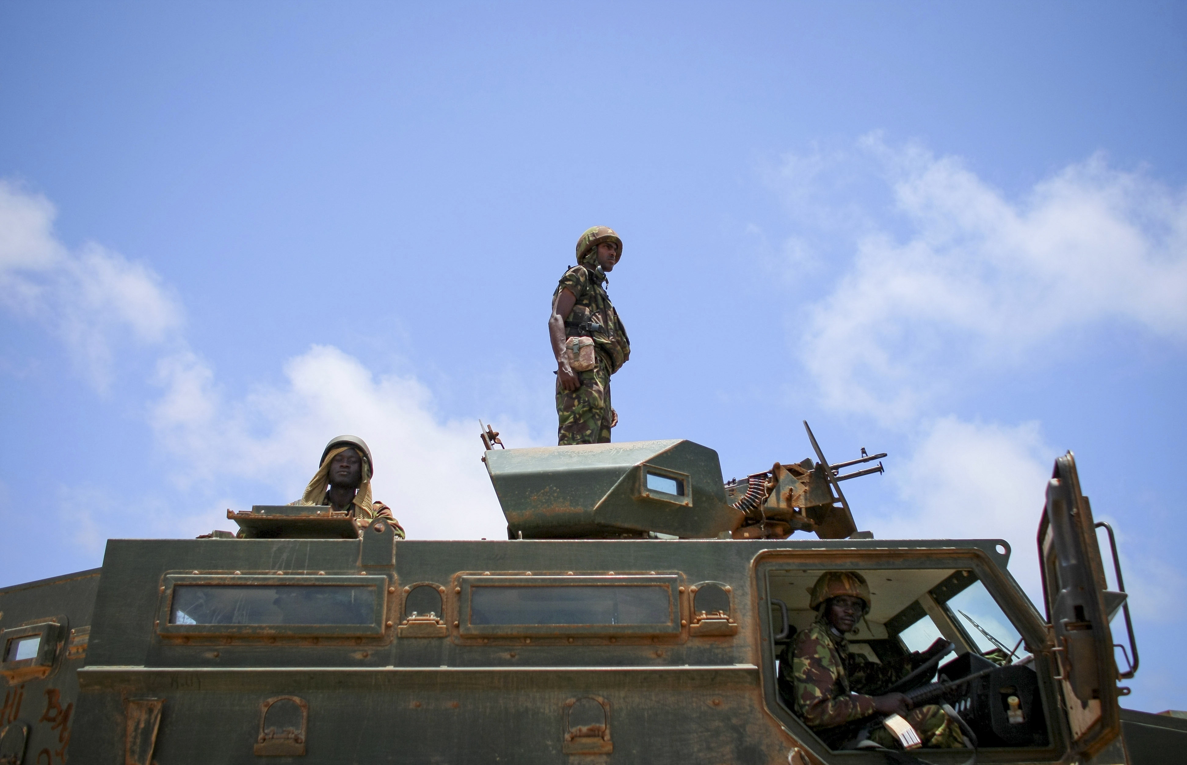 Kenyan soldiers from the African Union Mission in Somalia (AMISOM) on an armoured personnel carrier in Kismayo