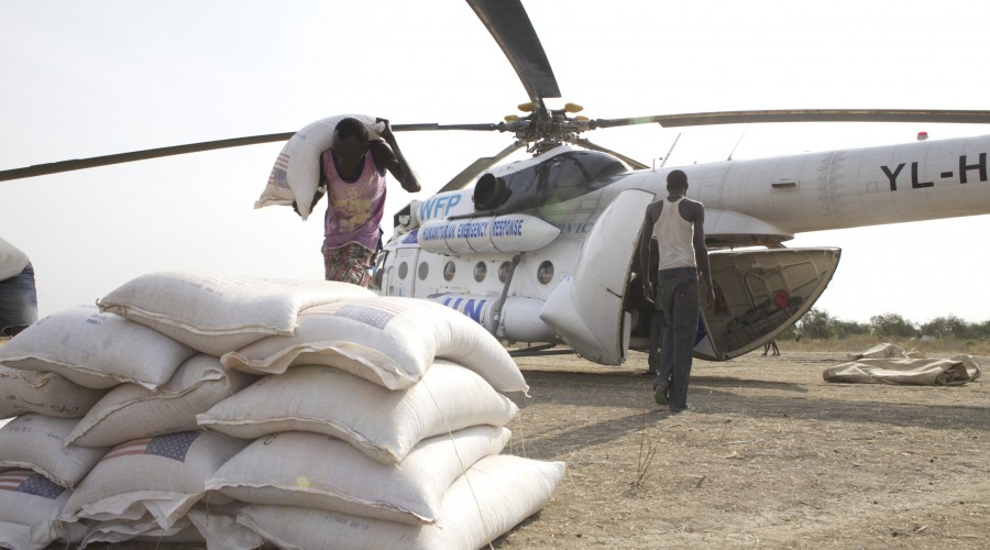 Loading a United Nations Humanitarian Air Service (UNHAS) helicopter to deliver assistance in Pibor county, Jonglei