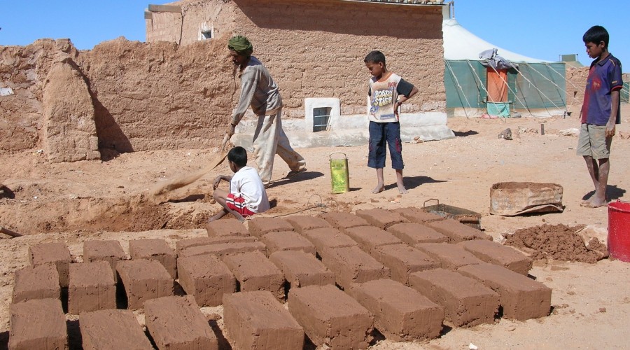 Families rebuilding using their own resources in a Saharawi refugee camp, Western Sahara
