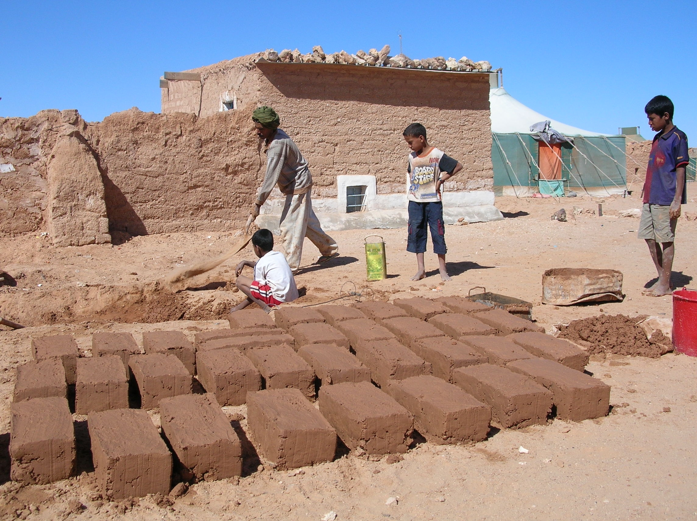 Families rebuilding using their own resources in a Saharawi refugee camp, Western Sahara