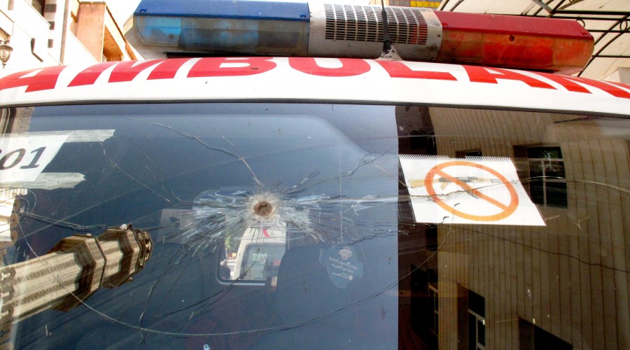 Bullet hole in a Syrian Arab Red Crescent ambulance outside of Homs, Syria in June 2012