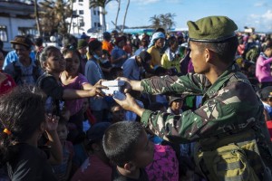 Philippine Army hands out packs of biscuits to displaced Filipinos
