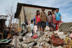 Corazon dela Cruz (40) with her four children putting their lives back together after there home was destroyed by Typhoon Yolanda