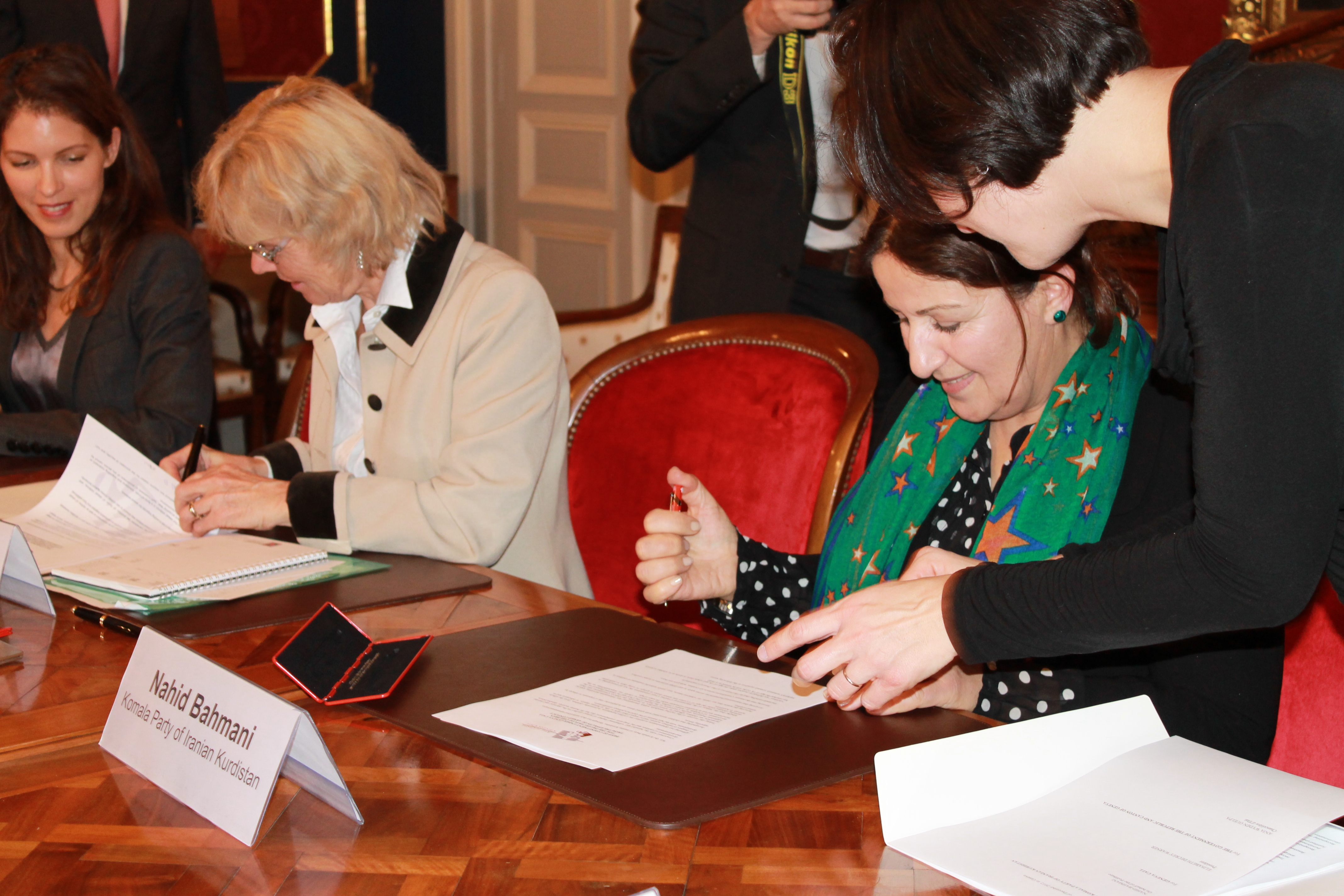 Geneva Call and a representative of the Komala Party of Iranian Kurdistan signing the Deed of Commitment prohibiting sexual violence and gender discrimination