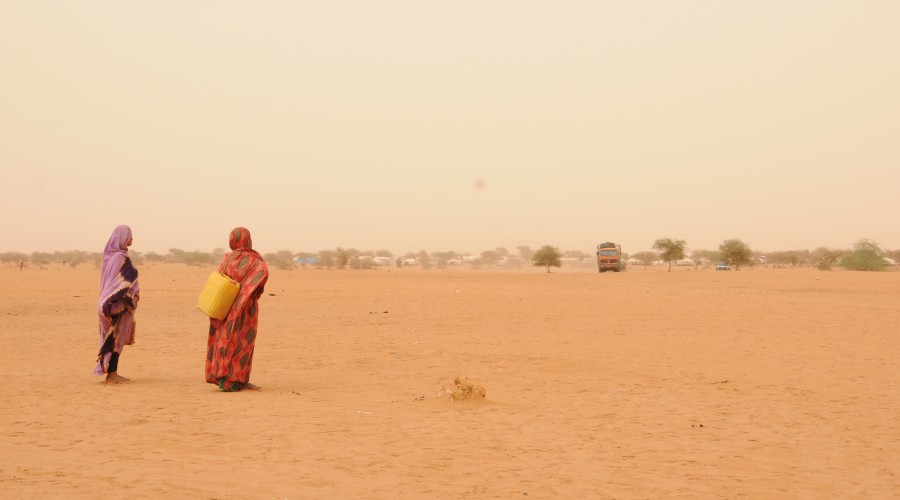 Women displaced by the conflict in Mali often walk long distances in search of water and wood outside makeshift camps in Niger