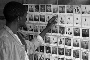 1994 Rwandan genocide. The British Red Cross sent 55 delegates to help in the region. Here, a father in Rwanda searches for his lost child using the Red Cross international family tracing service.
