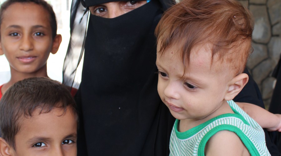 A mother and her children at the Al-Buraiqa polyclinic in Aden, Yemen