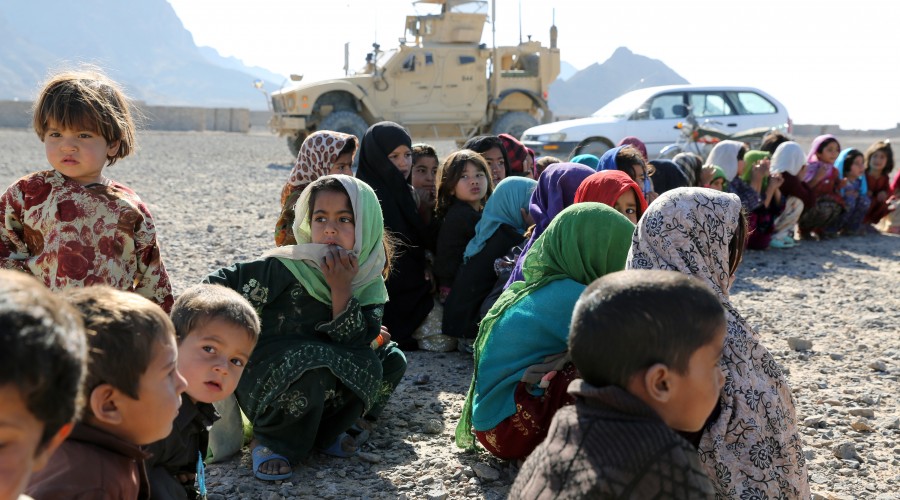 Visit from civilian and military members of the Provincial Reconstruction Team to a local returnee and refugee village in Afghanistan