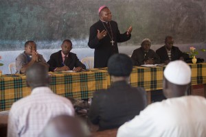 Bangui's Archbishop Dieudonne Nzapalainga (centre) and Imam Kobine Layama (right) address Muslims during a peace and reconciliation meeting in Bangassou