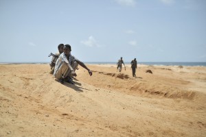 Young men stand guard during a demonstration by a local militia in Marka, Somalia