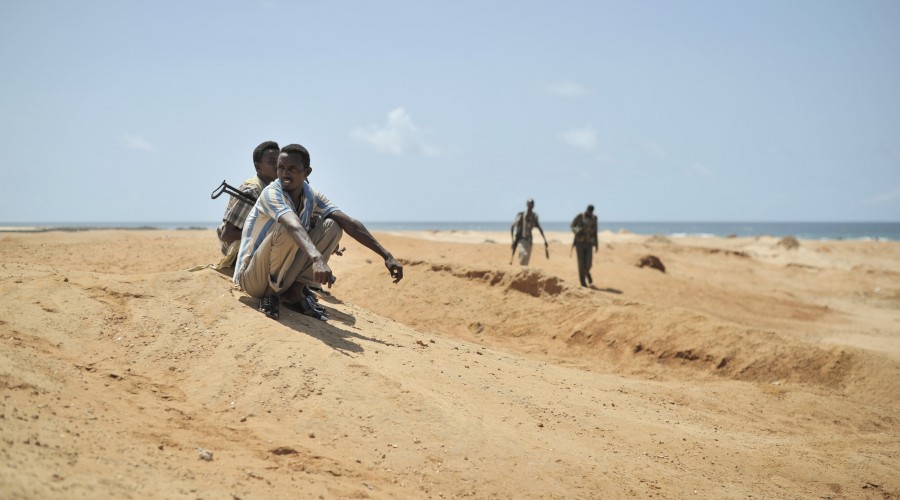 Young men stand guard during a demonstration by a local militia in Marka, Somalia
