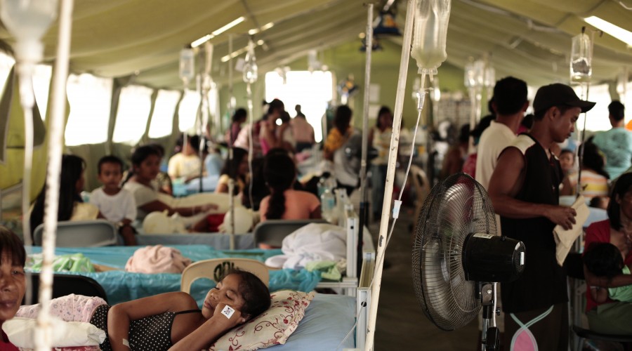 Patients in a temporary hospital. Over 600 health facilities were damaged or destroyed by Typhoon Haiyan.