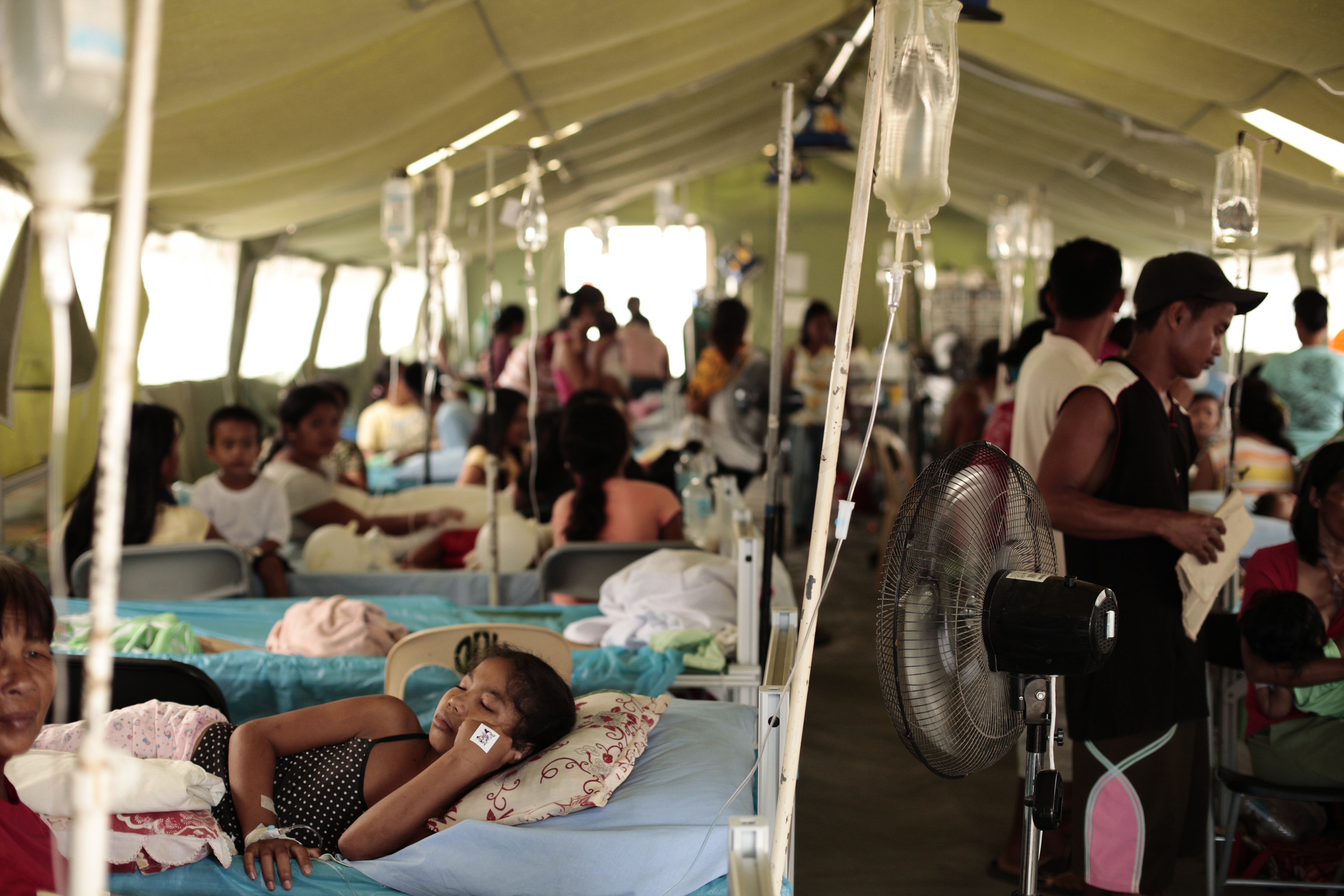 Patients in a temporary hospital. Over 600 health facilities were damaged or destroyed by Typhoon Haiyan.