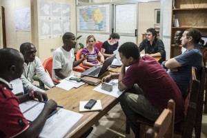 A team meeting of staff coordinating an Ebola treatment centre in Nzérékoré, Guinea