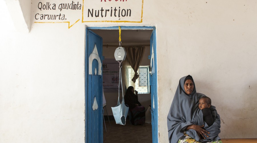 A mother holds her daughter at a health centre in the Karkaar region of Puntland, Somalia