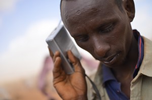 A man listens to a radio in the Ifo Extension refugee camp in Dadaab, Kenya