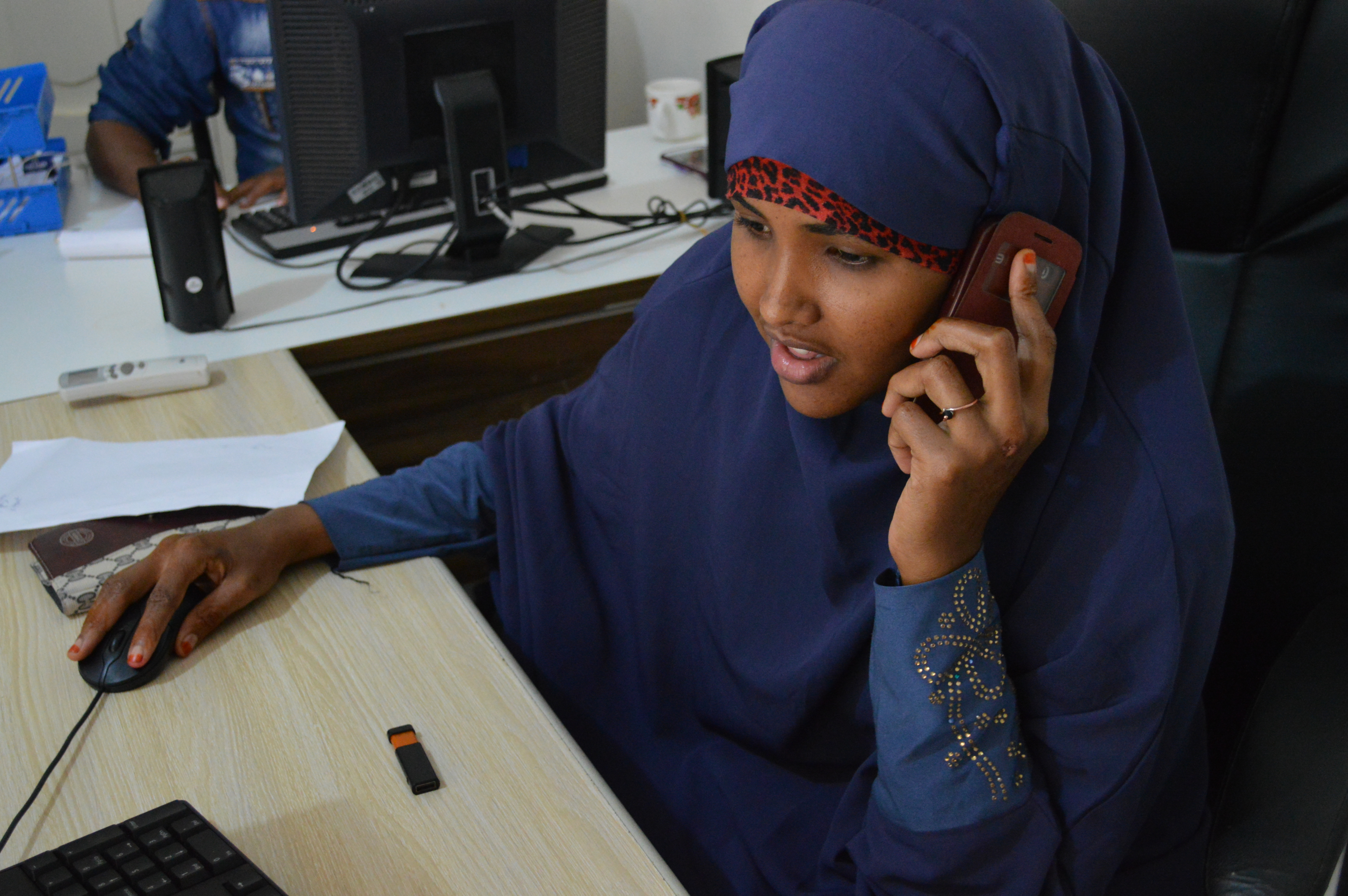 A phone operator for a food security monitoring project in Gaikayo, Somalia