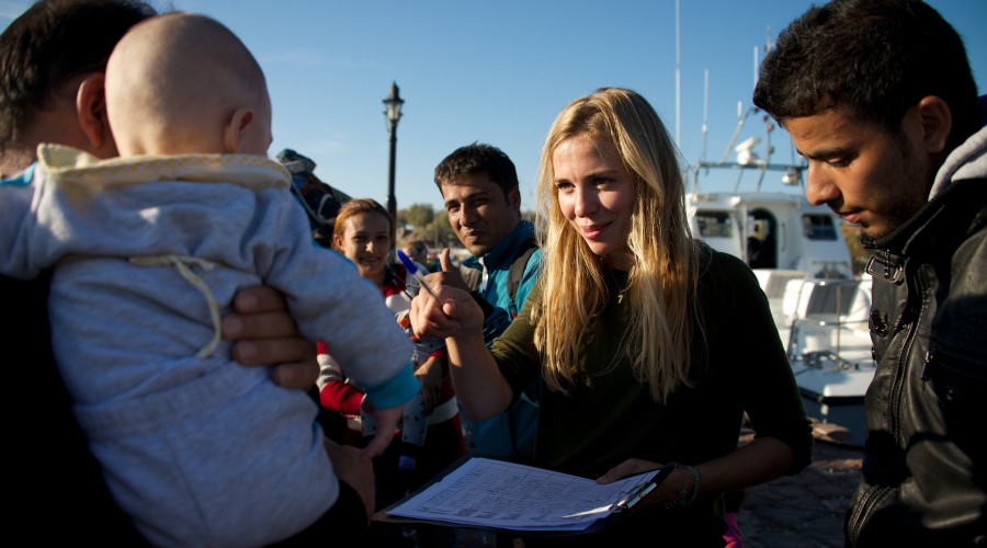 Volunteer assisting with the registration of refugees rescued by the coast guard in Lesvos, Greece.