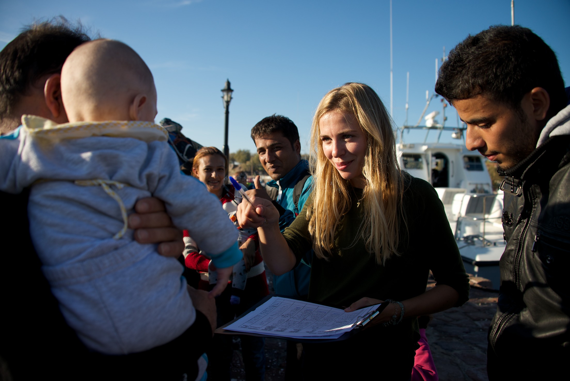 Volunteer assisting with the registration of refugees rescued by the coast guard in Lesvos, Greece.