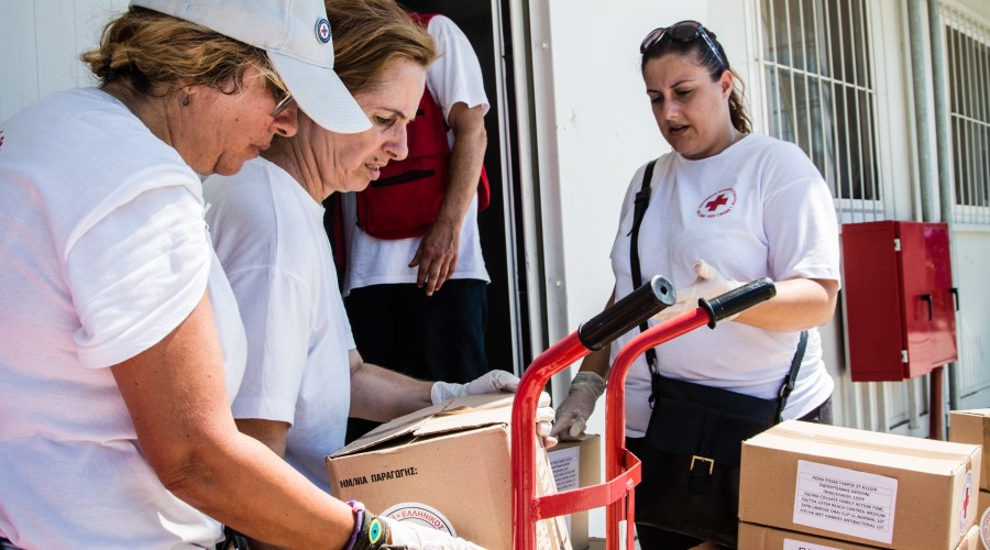 Hellenic Red Cross volunteers bring relief items to a reception centre on the island of Lesvos, Greece.