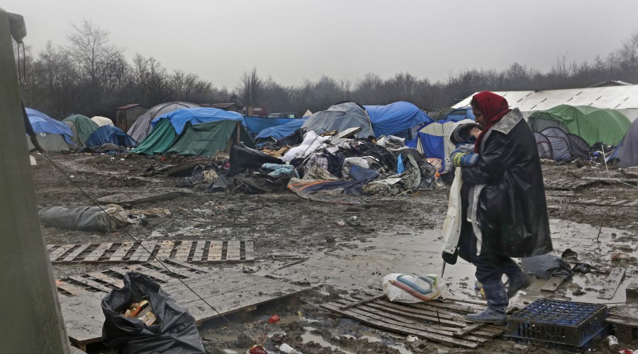 A woman and child at the old Grande-Synthe camp site near Dunkirk, France.
