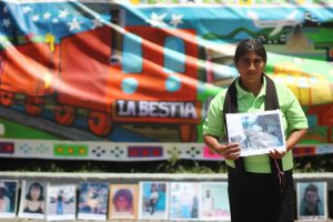 Families of missing migrants painted their experiences on a collective mural to highlight their need.