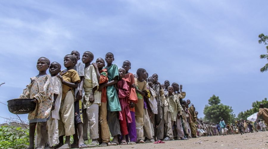 Internally displaced children wait for the distribution of ready-to-use supplementary food in Banki IDP camp, Borno state, northeast Nigeria.