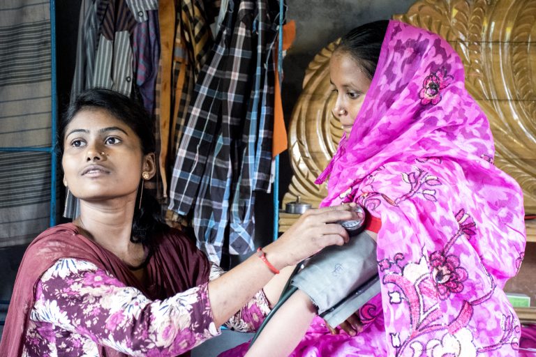 Women receiving treatment at Gonoshsthaya Community Health Center outside Dhaka, which provides health care and health insurance to underserved populations in Bangladesh.