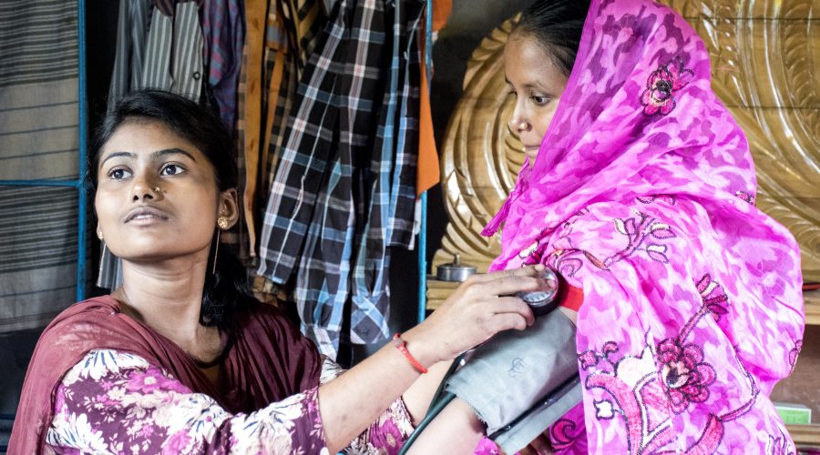 Women receiving treatment at Gonoshsthaya Community Health Center outside Dhaka, which provides health care and health insurance to underserved populations in Bangladesh.