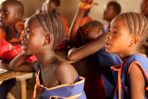 Children listening in a school in Sierra Leone.