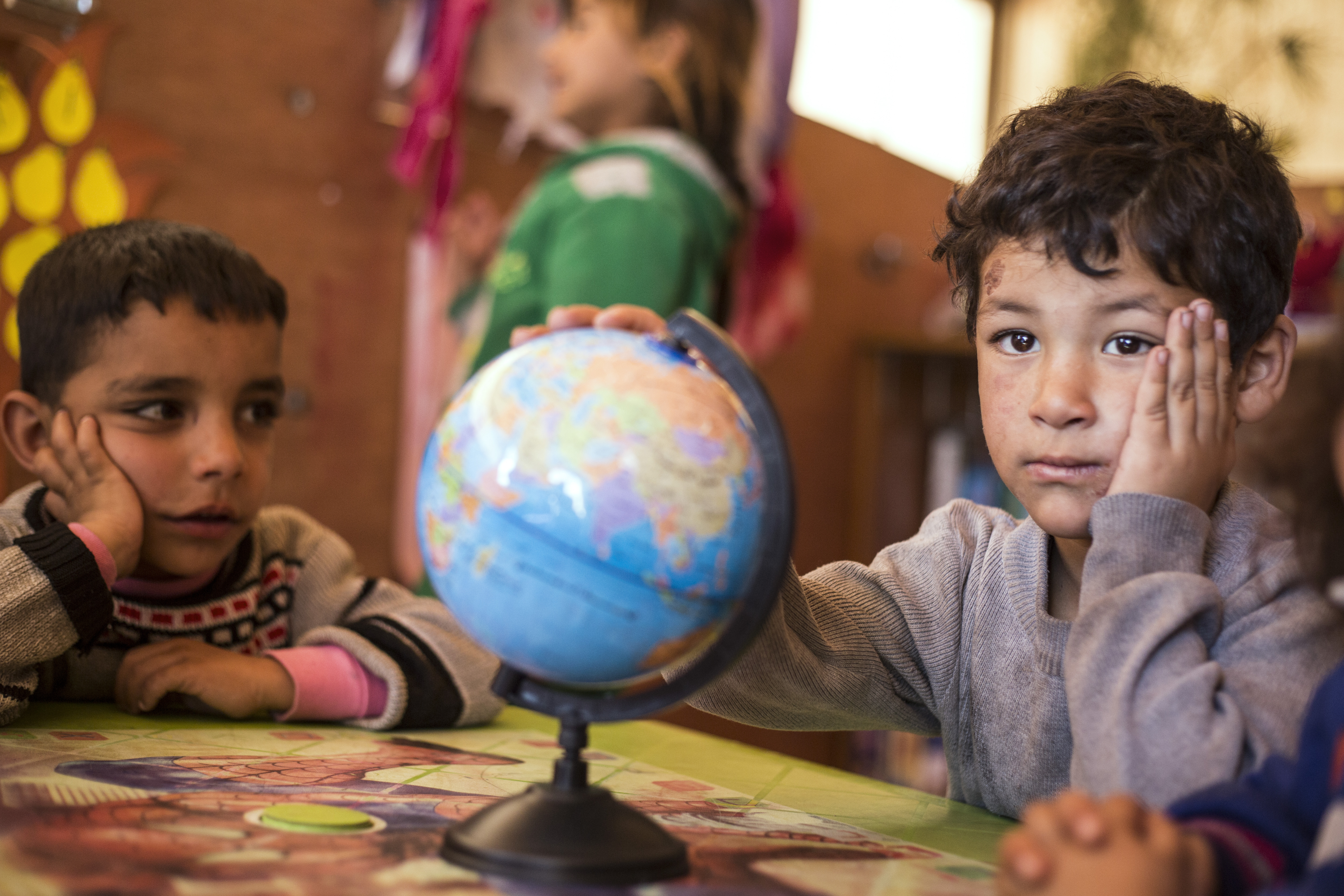 Mahmoud (right) is a five-year-old Syrian boy from Al-Raqqa.