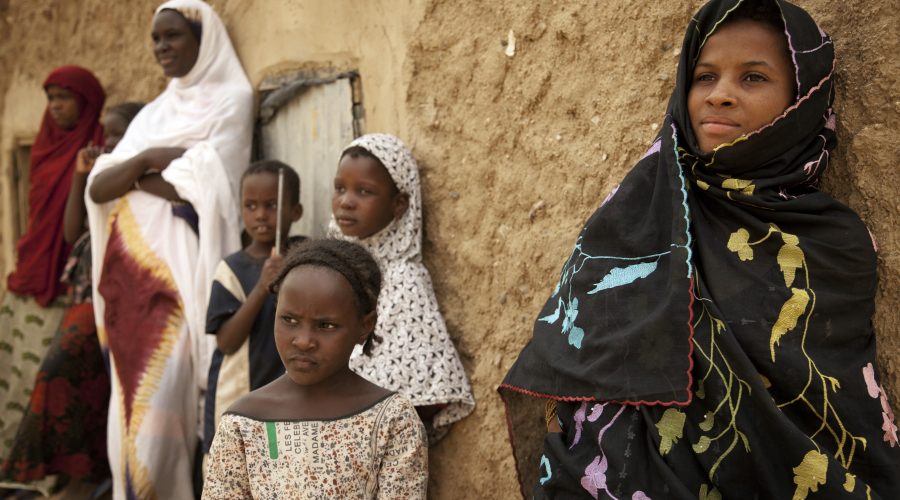 Women and girls stand in the shade in Kidal, northern Mali.
