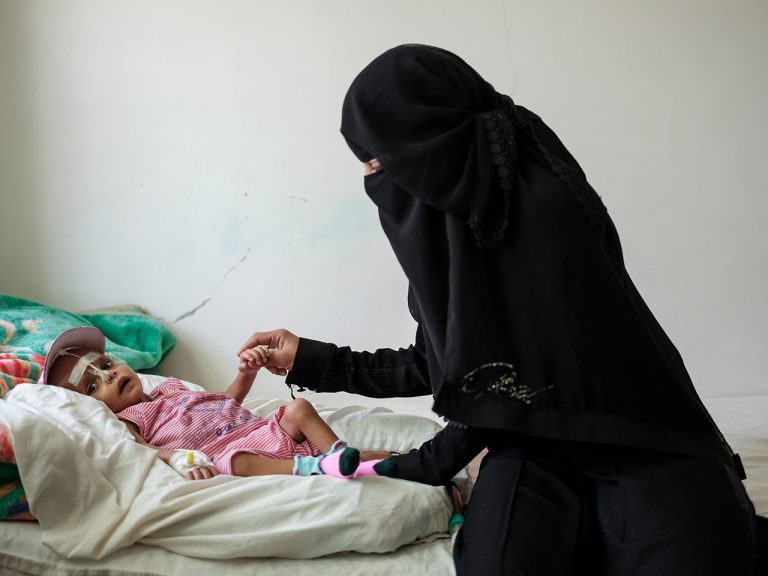 3-year-old Hassan, suffering from Thrombocytopenia Anaemia and malnutrition, is seen playing with his aunt on a bed inside the Inpatient Therapeutic Feeding Center, inside the MSF run Mother and Child Hospital in Taiz Houban, Yemen