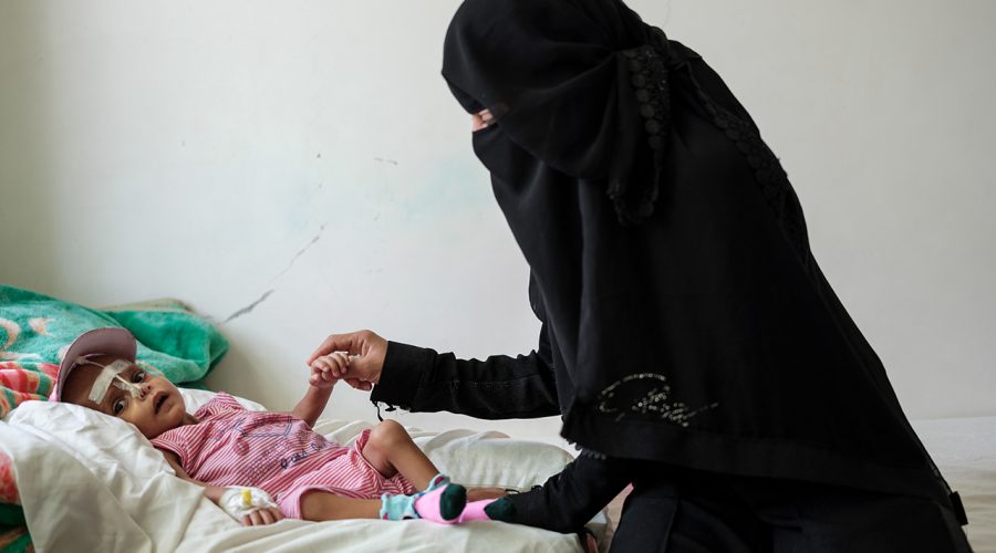 3-year-old Hassan, suffering from Thrombocytopenia Anaemia and malnutrition, is seen playing with his aunt on a bed inside the Inpatient Therapeutic Feeding Center, inside the MSF run Mother and Child Hospital in Taiz Houban, Yemen