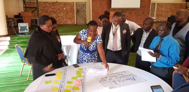 Piloting participants in Uganda working on the Gap Analysis Tool.