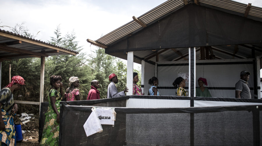 People are seen lining up to get their temperature checked at an MSF supported triage, before heading into Bunia’s general hospital.