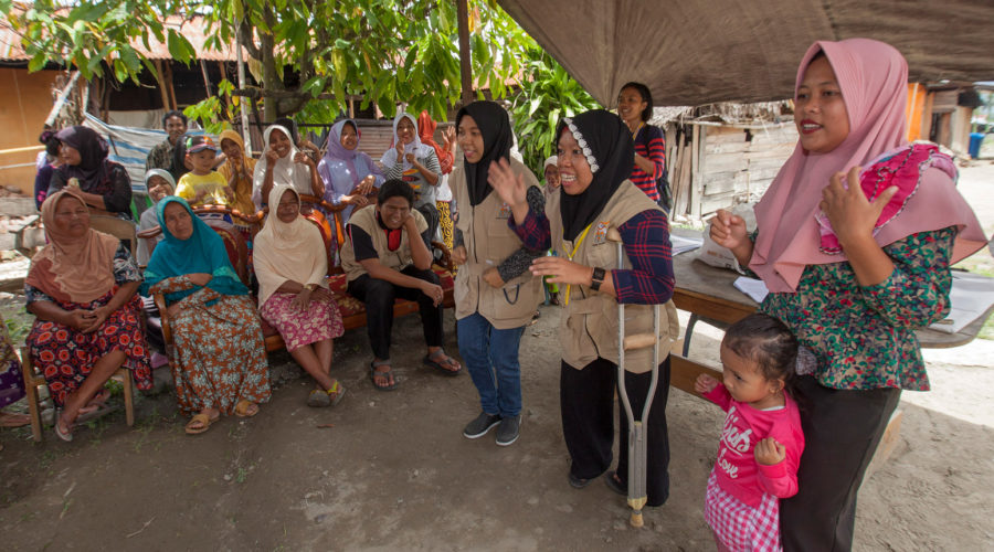 Members of Organisation of Persons with Disabilities-OPDs (wearing khaki vest) delivering hygiene promotion session for community members of Mantikole Village in Sigi, Central Sulawesi. Local OPDs are ASB Indonesia and the Philippines main partners in delivering inclusive humanitarian assistance particularly in WASH services, including for the tsunami and earthquake affected community in Central Sulawesi, Indonesia.
