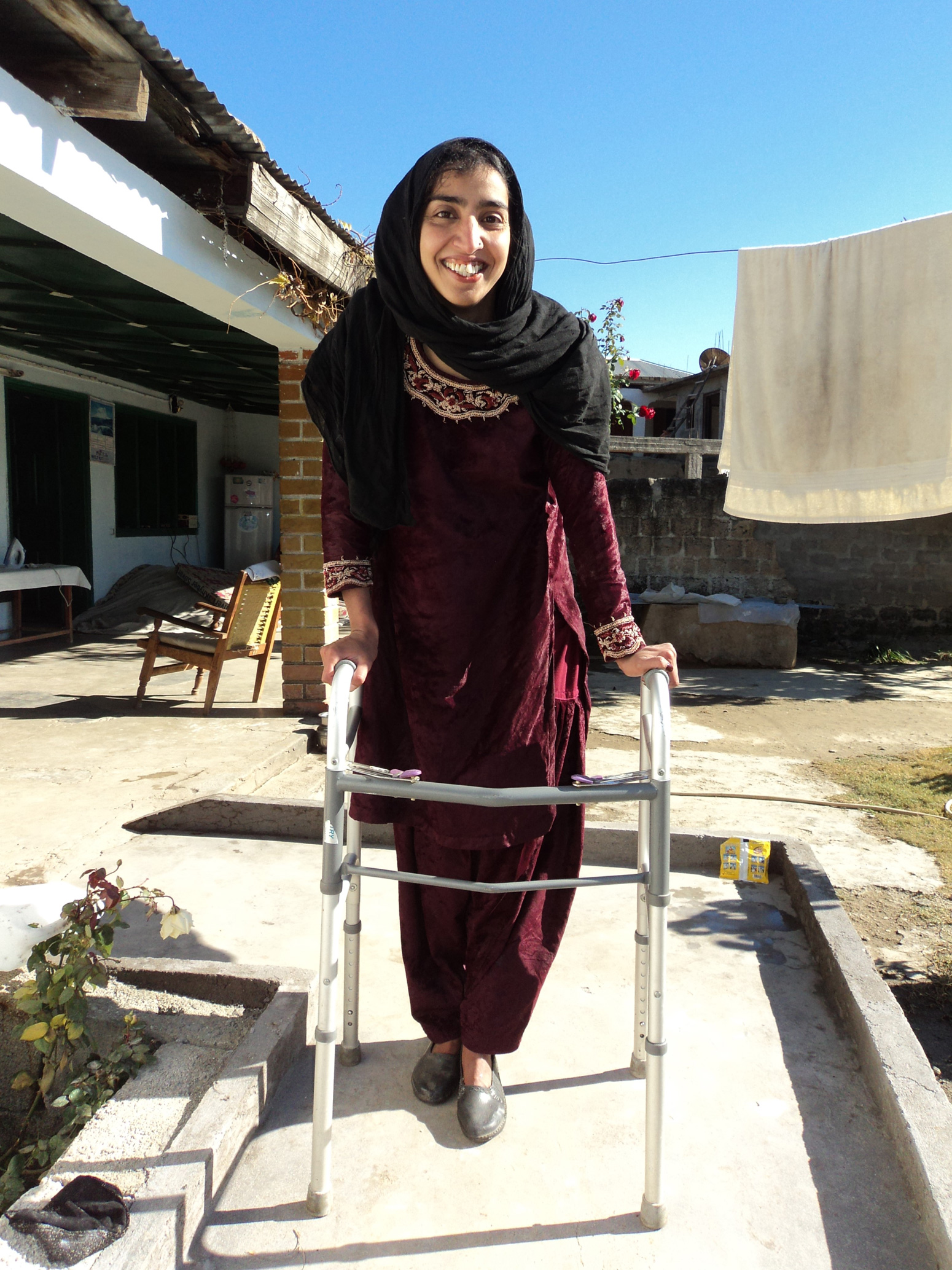Mansehra District, Pakistan: a student enjoys improved access to education after assistive devices and accessibility ramps are provided at her school HRDS/Afzal
