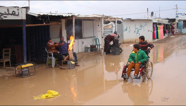 Wheelchair user moving through Zaatari Camp, Jordan . Credit: Unicef