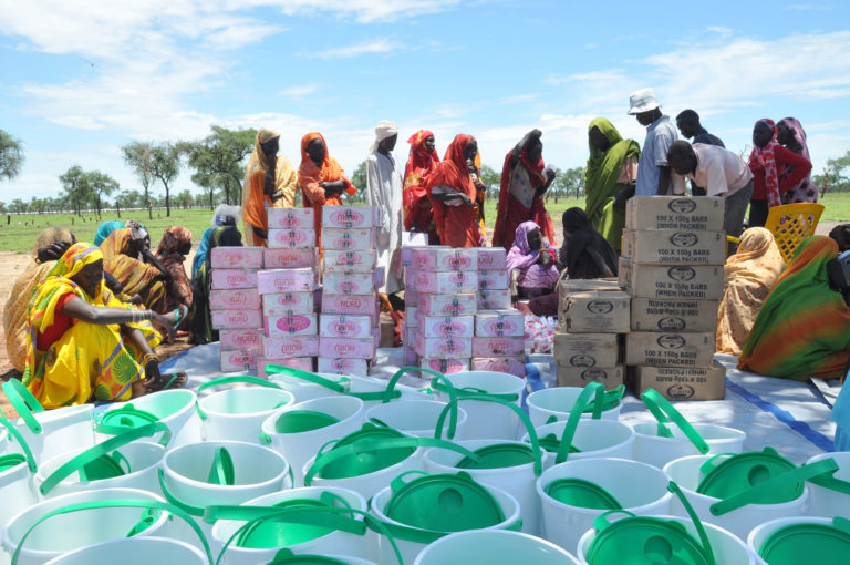 Refugees in Jamam camp queue up to receive buckets and soap as part of Oxfam's public health campaign to reduce the spread of diseases such as cholera, diarrhoea and Hepatitis E in the camp.
