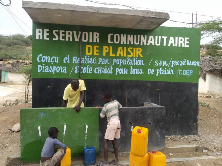 Community water reservoir and filling station.