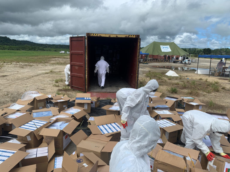 Port Vila International Airport during the Tropical Cyclone Harold response: government staff process received humanitarian supplies for fumigation.